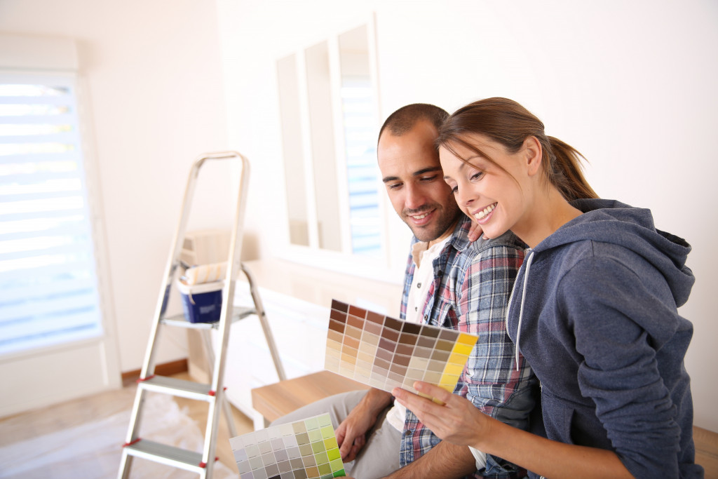 couple picking wall paint for home