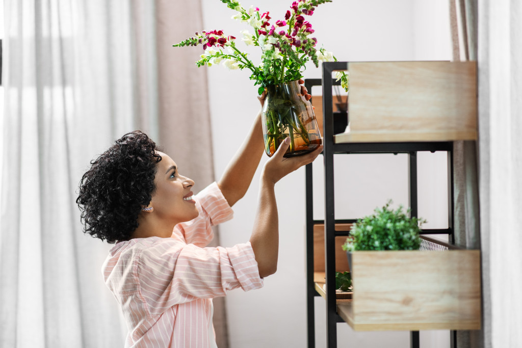 woman placing plants