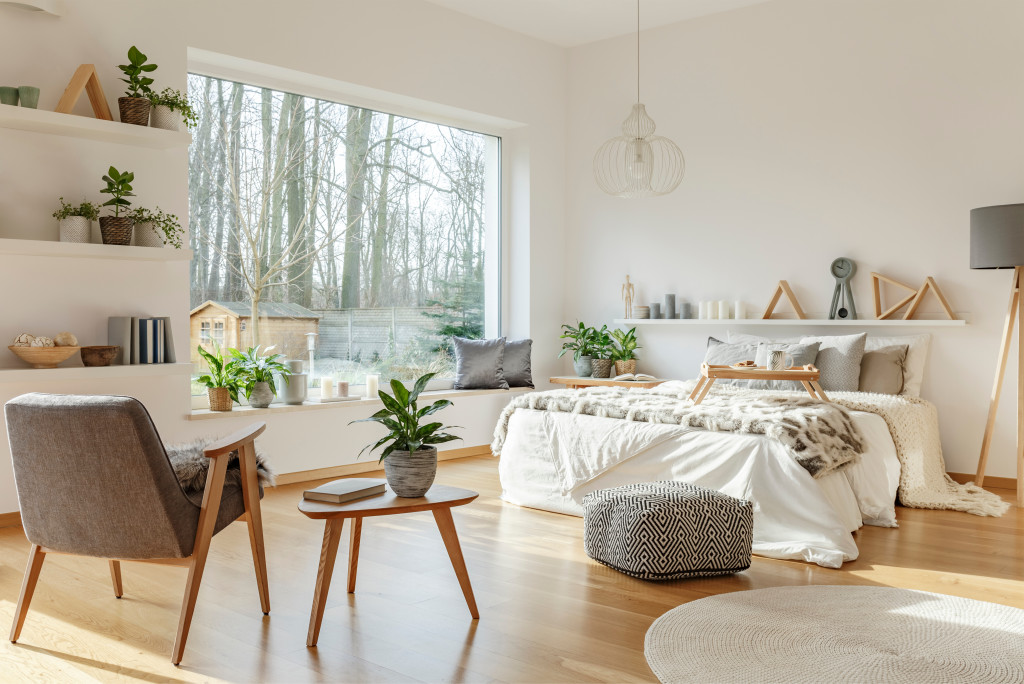 spacious bedroom interior with big window