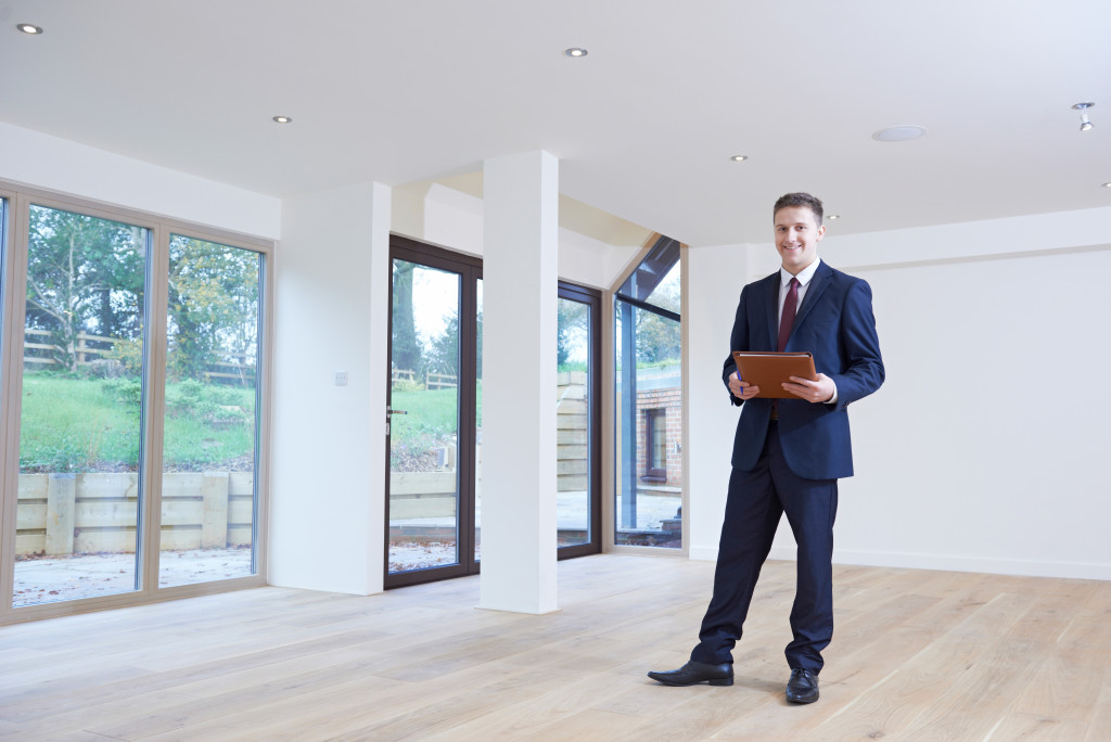 property manager standing inside an empty space