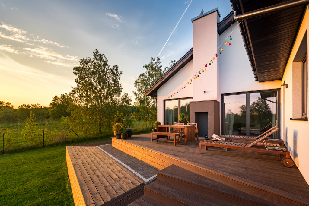 house's exteriors at sunset with string lights hanged at the top